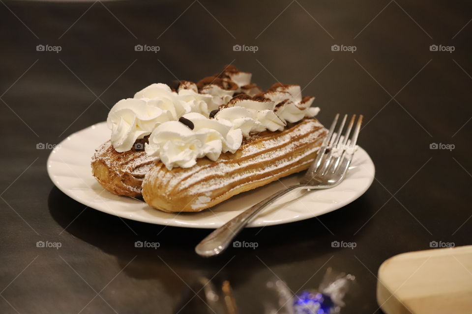 Eclairs on a plate, ready to eat