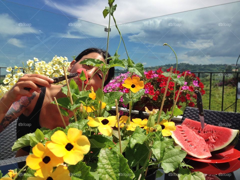 A fresh moment. A fresh moment under the Sun between flowers and watermelon