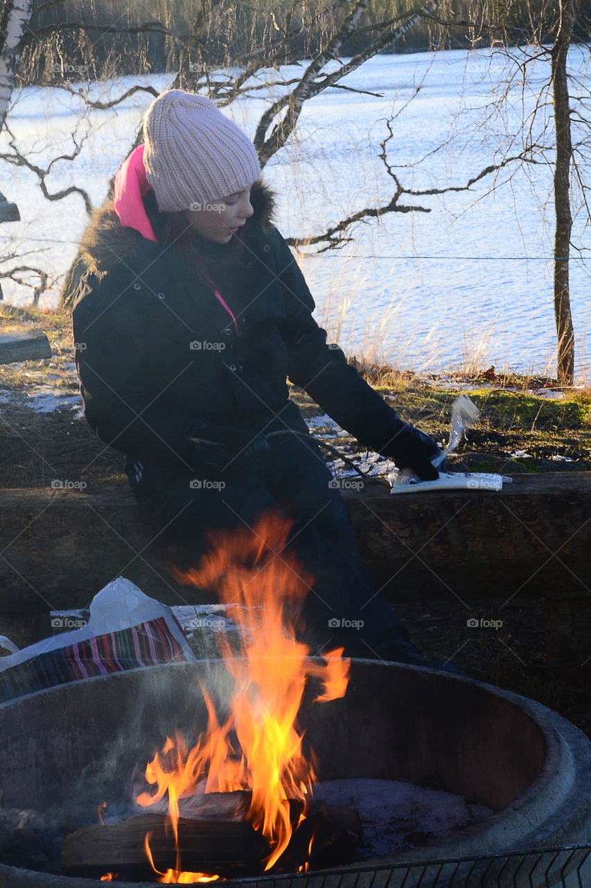 At the fireplace outside