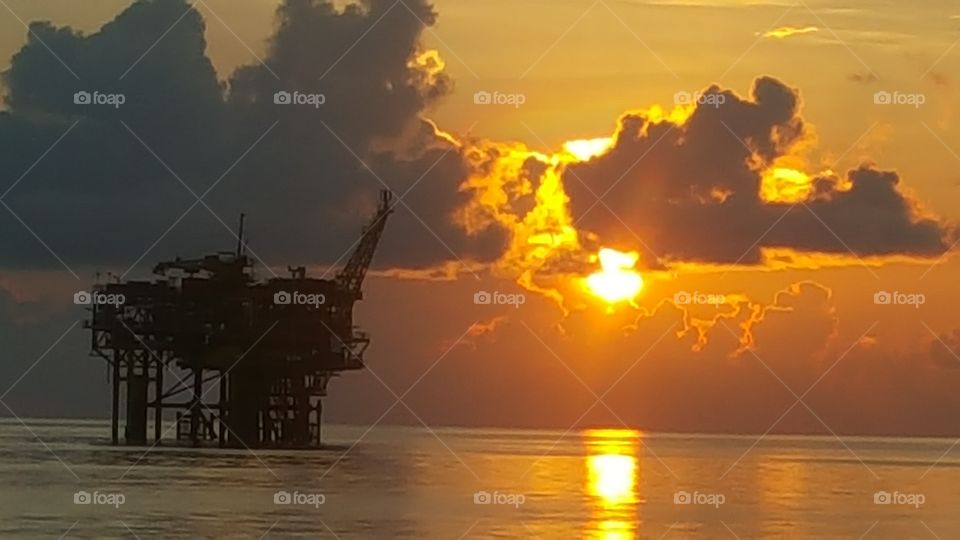 Oil rig sunset in offshore