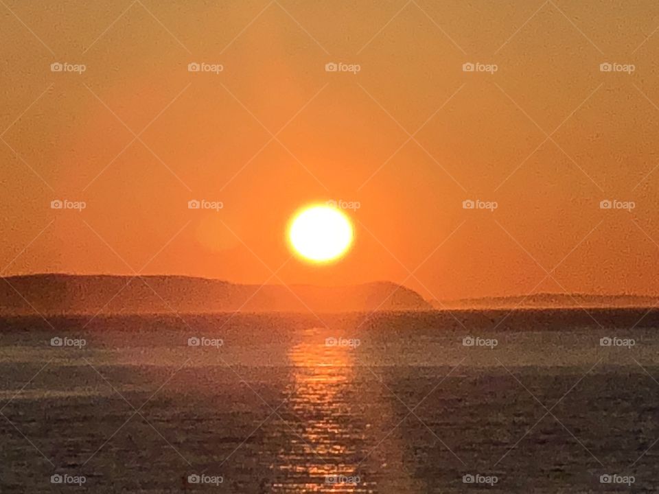 Sunset upon the sky line of Walton, Nova Scotia, Canada. Captured the big and beautiful sun as she set for said day