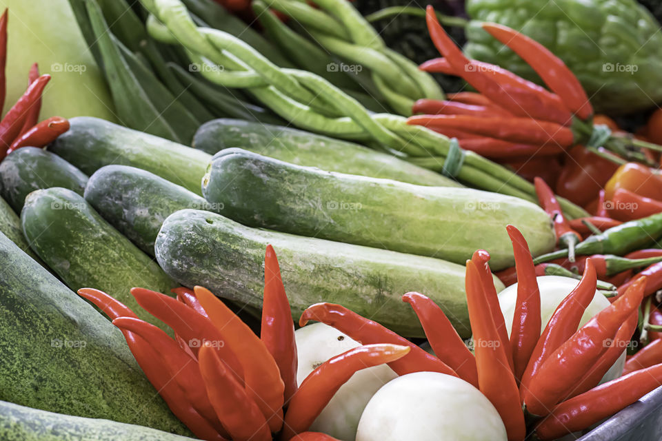 Vegetables in Thailand Cucumber , Tomato , Bitter gourd and red chilli.