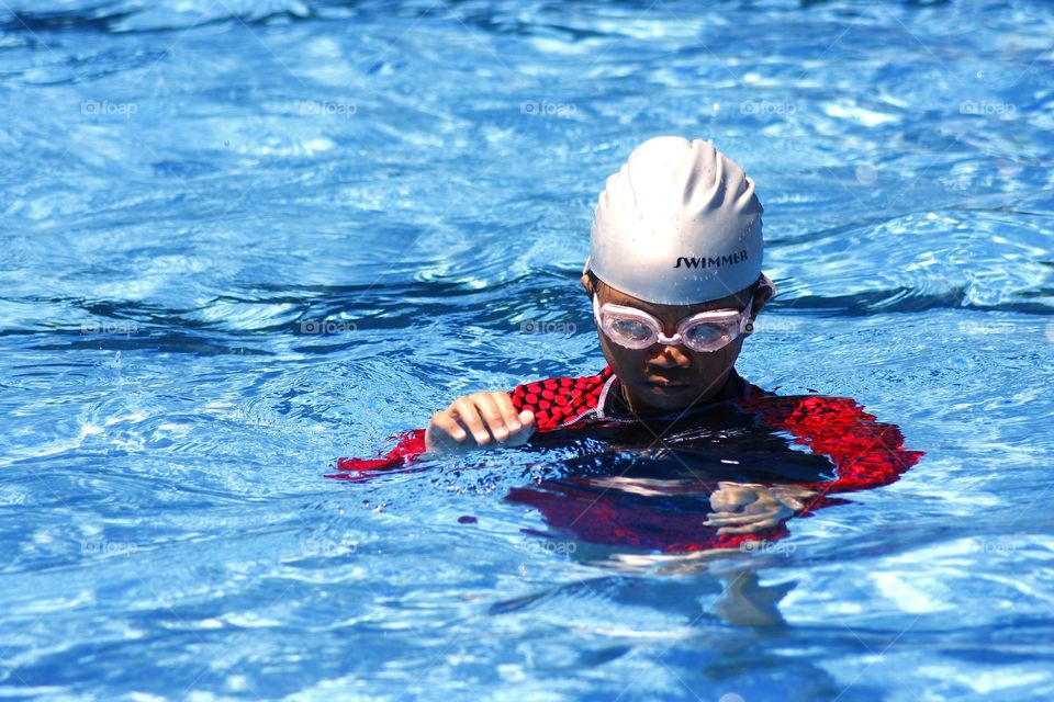 young girl in a swimming pool