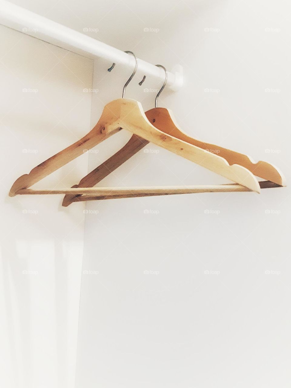 Wooden hanger against on white background