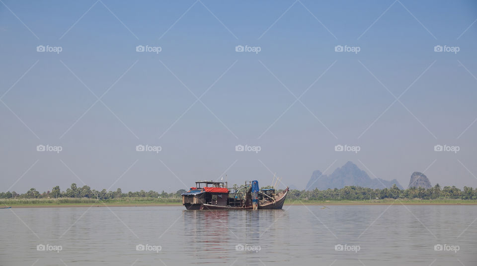 Fishing Boat on a river in Asia