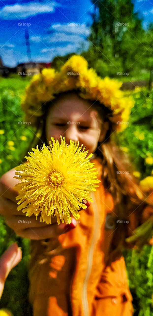 girl with yellow dandelion