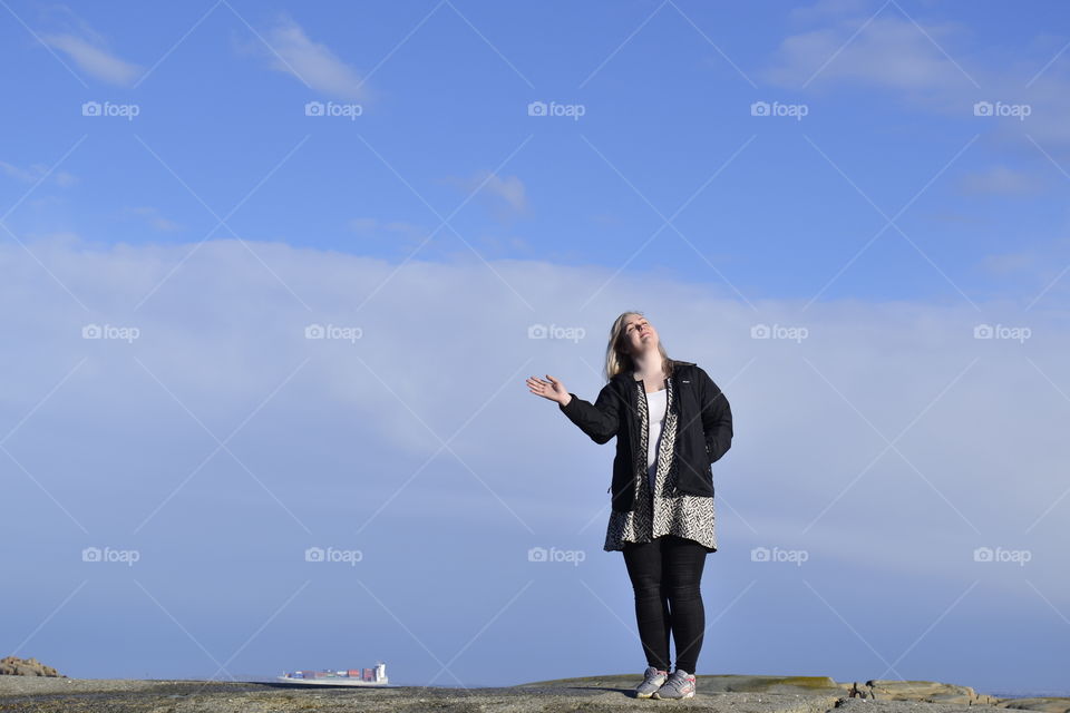 Woman standing on land and looking up