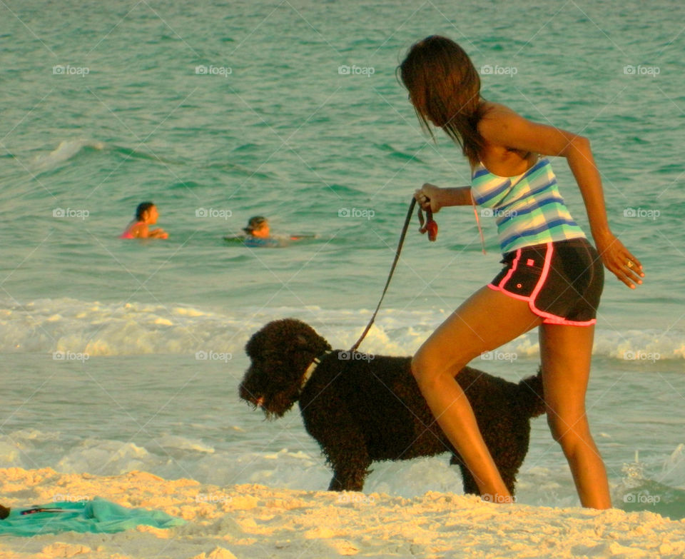 Running along Gulf of Mexico. This young lady was out for a run with her dog along the Gulf of Mexico.