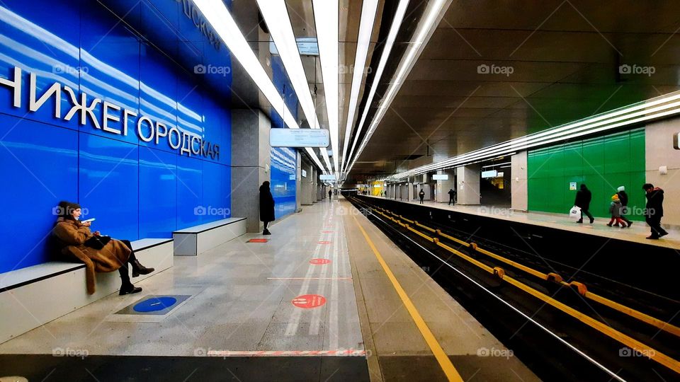 View of modern architecture in new Moscow metro station, bright urban scenery with people