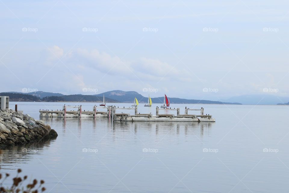 Boats sailing in peaceful ocean 