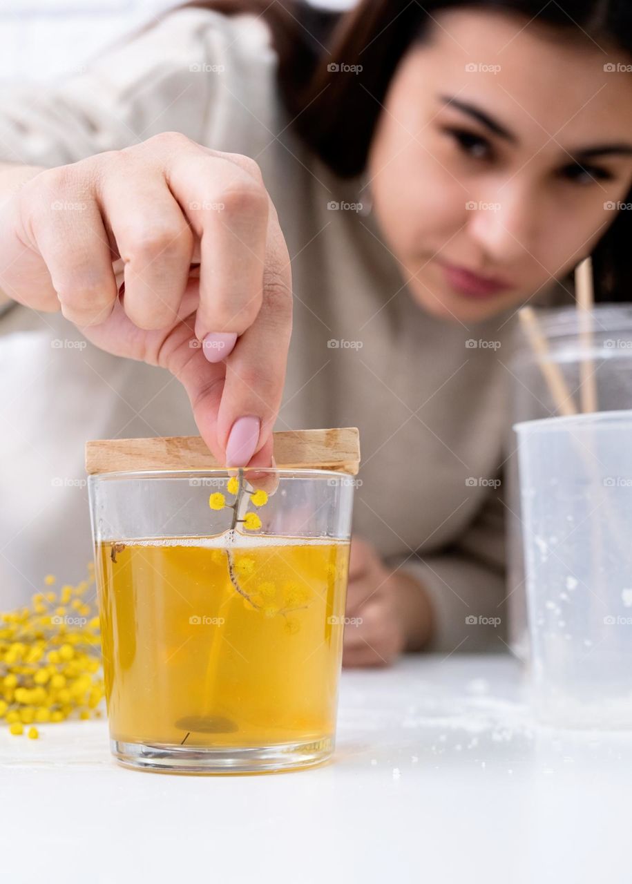 woman making candles