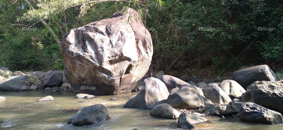 The big rock in the middle of the river