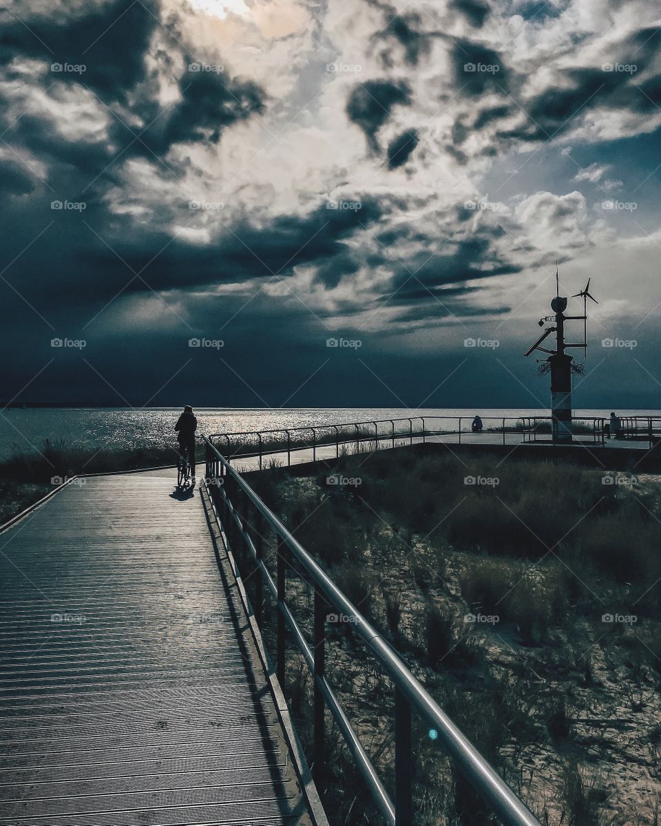 Wooden pier with stormy cloud