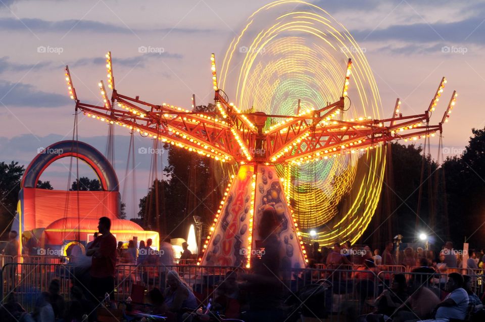 Beauty in motion. Night time excitement, amusement park rides. 