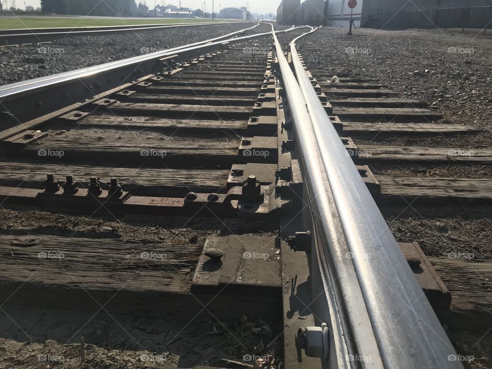 Sunlight gleams off lonely railroad tracks along the Union Pacific route.