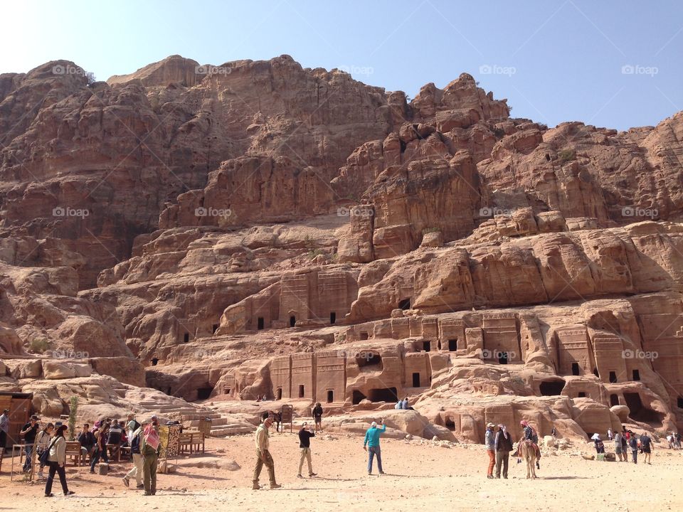 Tourists admiring the beauty of Petra, Jordan.