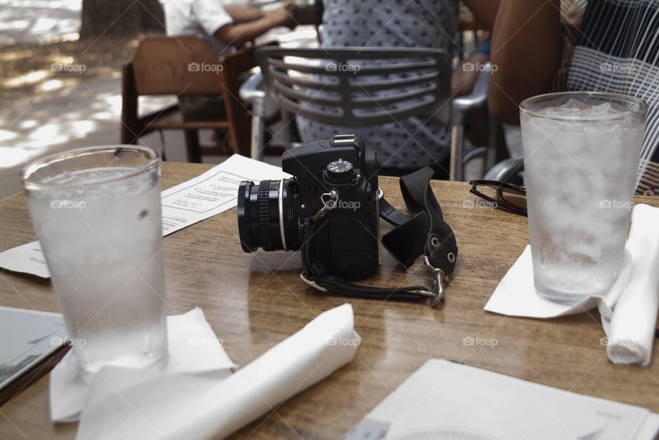 A camera sits on a restaurant table in historic downtown Savannah, Georgia.