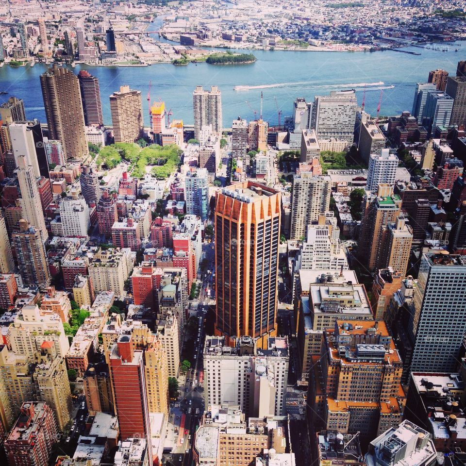 NYC. View from the Empire State Building. Skyline. New York City  views. City-scape  miles and miles... River and bridge, harbor along the city. Orange buildings. 