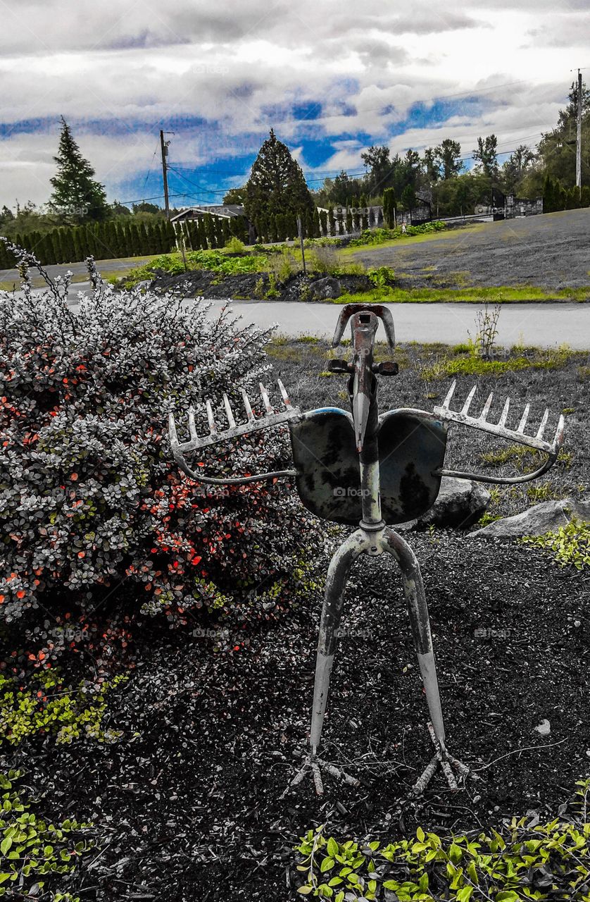 Bird ornament made out of old garden tools in British Columbia 