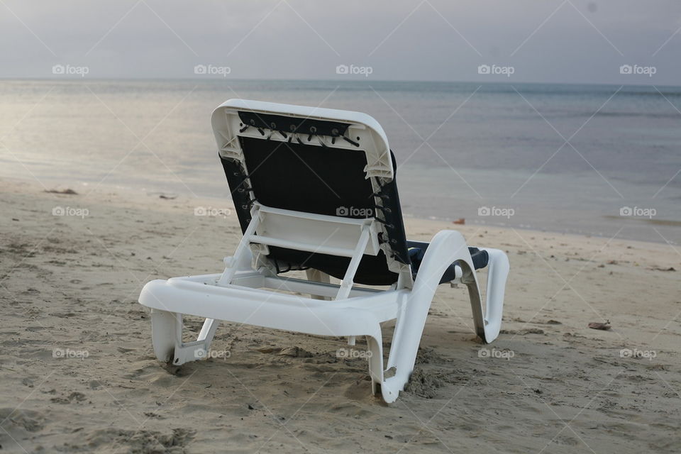 chair deck on a lonely beautiful sandy beach