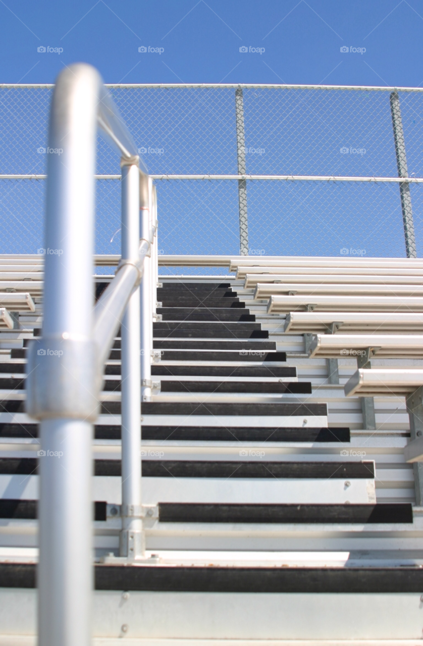 Bleachers
Bleachers in a stadium with the view of some stairs.