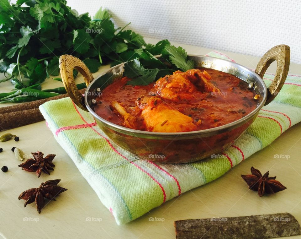 Homemade chicken curry with ingredients 