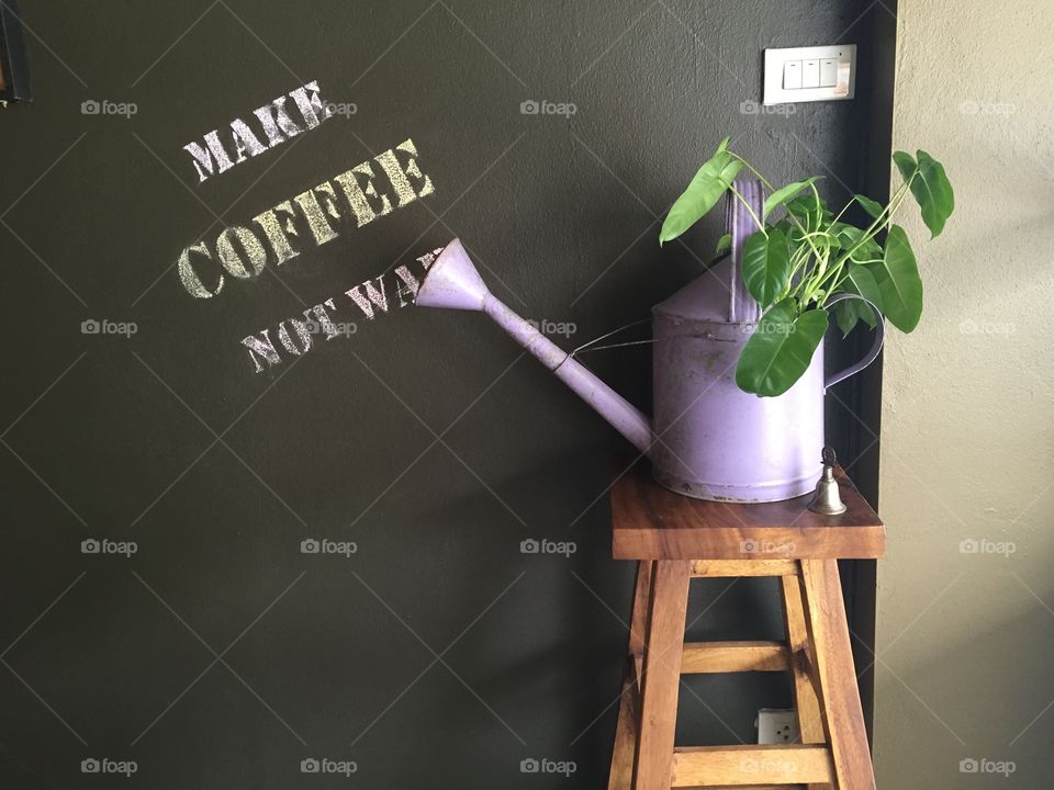 Plant in vase . Corner of coffee shop