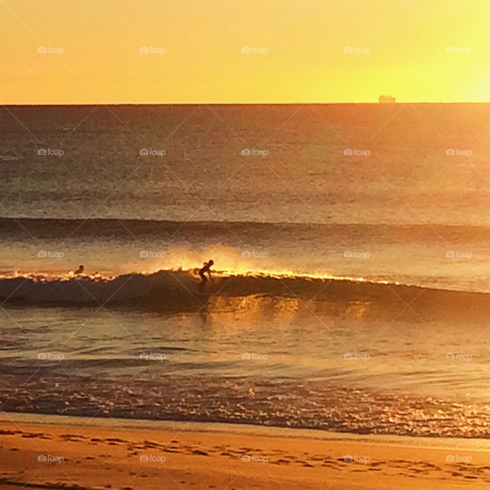 Morning sunrise surfing