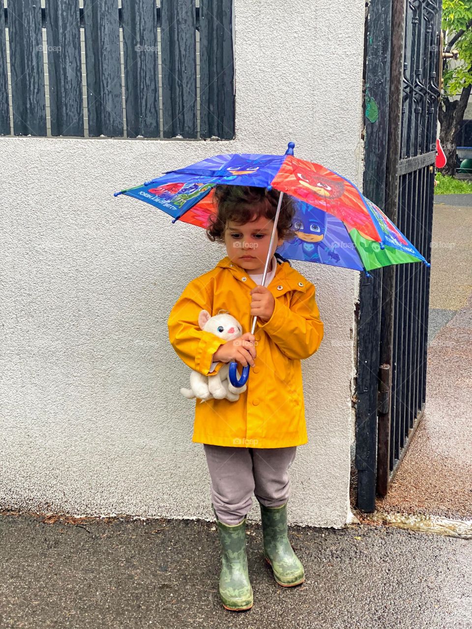 Waiting for mom in the rain