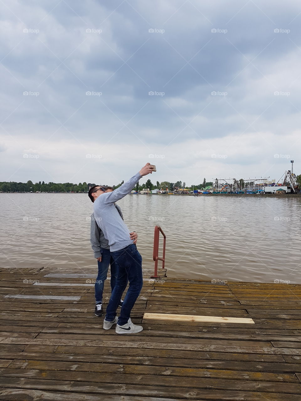 Couple taking selfie at dock