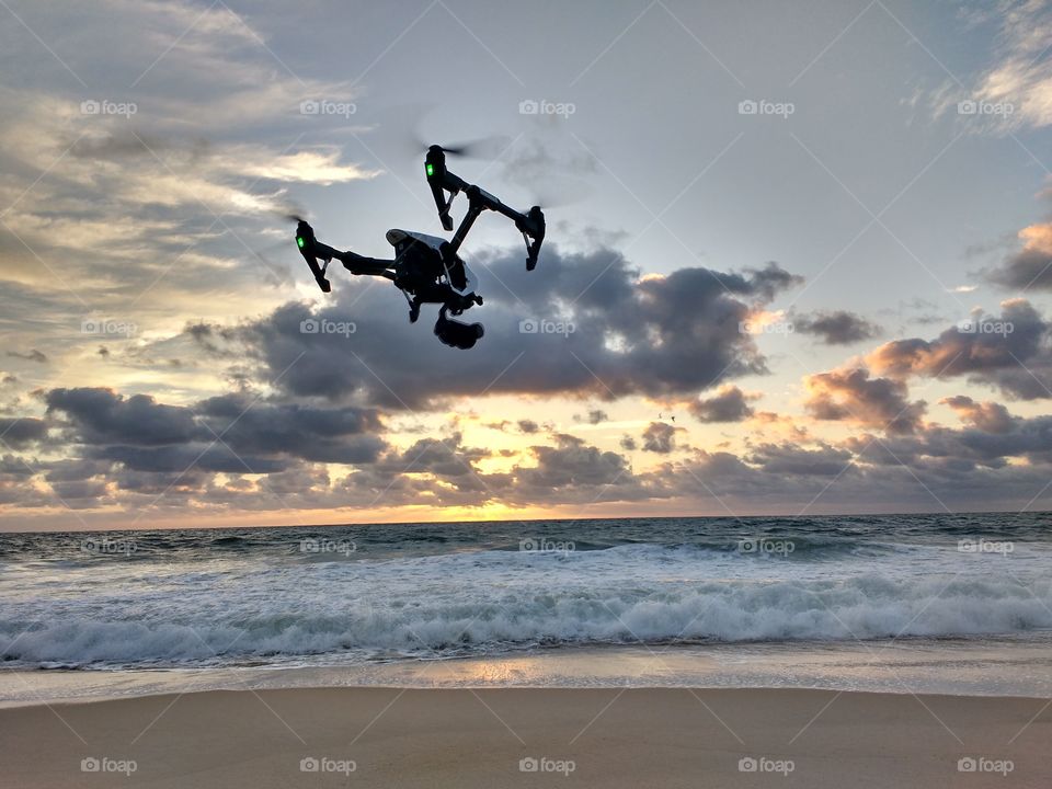 Inspire 1 drone flying over the ocean surf
