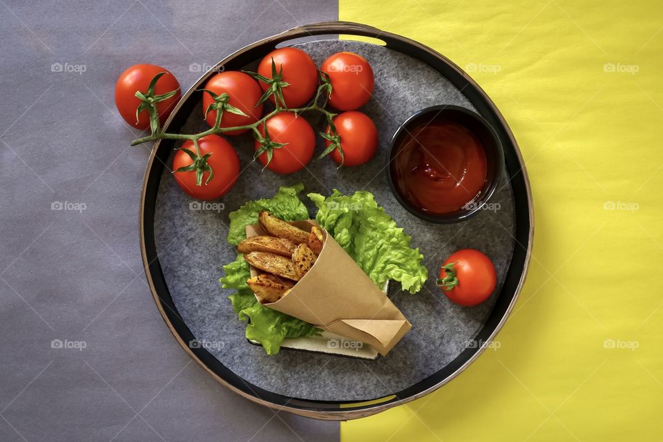 fried homemade potato with tomato ketchup