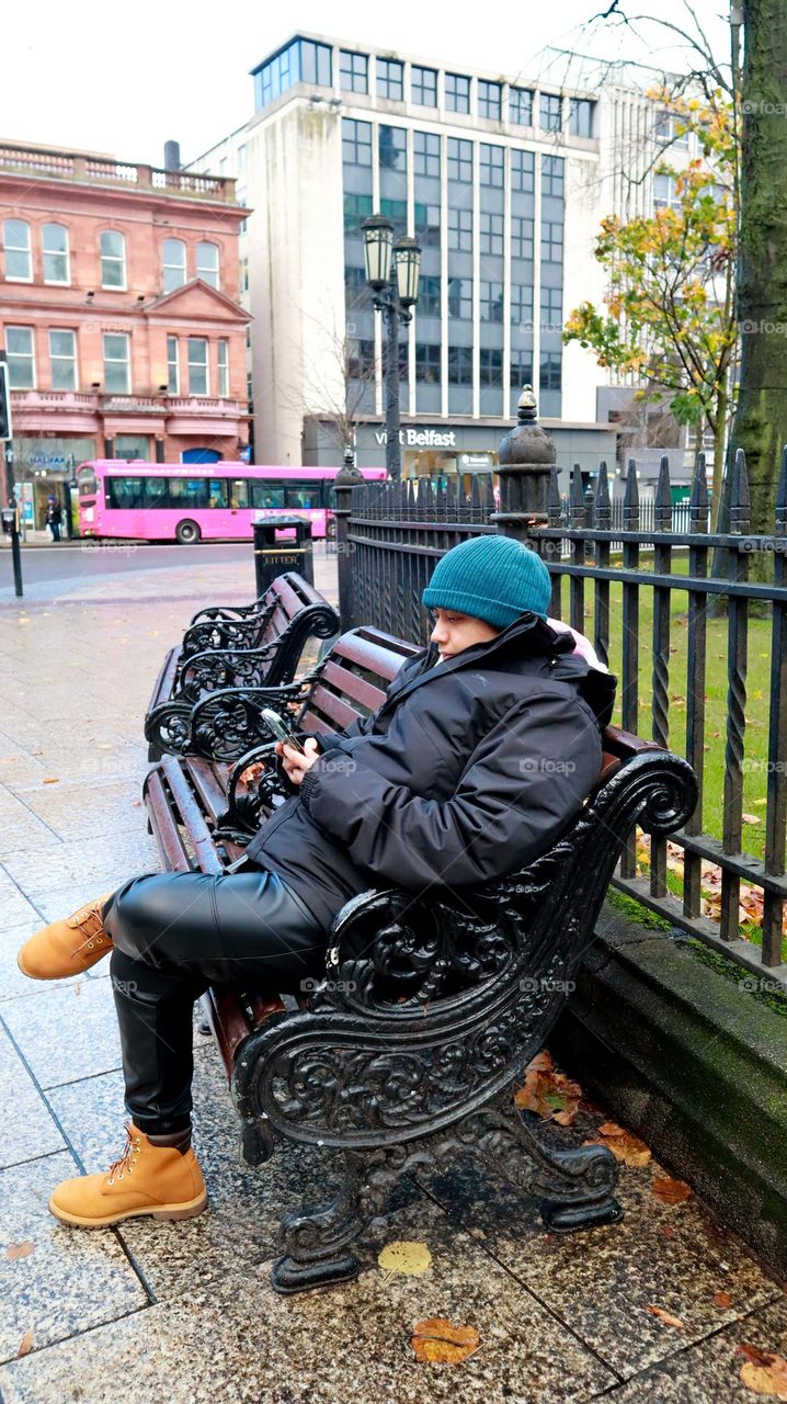 Lady busy watching on her phone 
