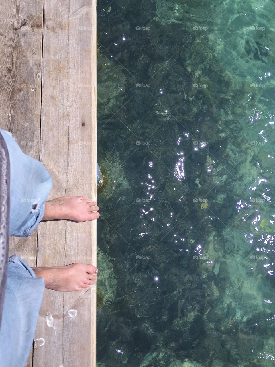Woman standing at the end of a jetty