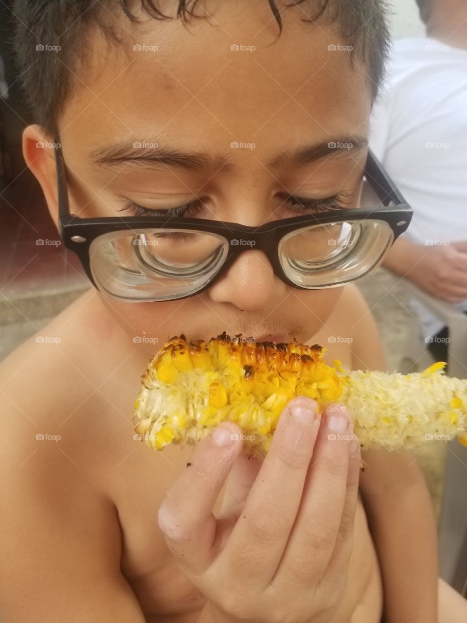 Child Eating Corn on Cob