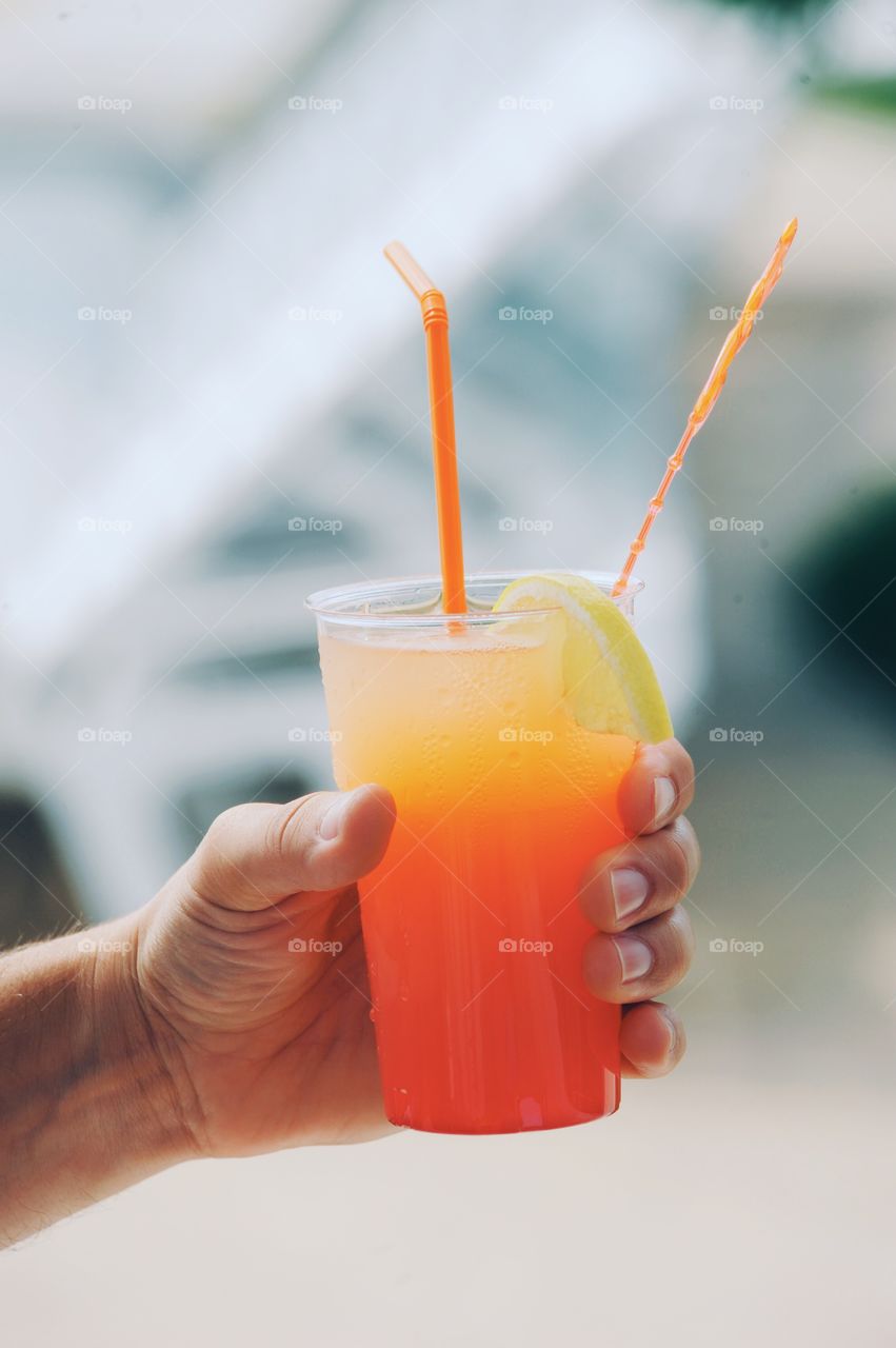 Person holding coctail