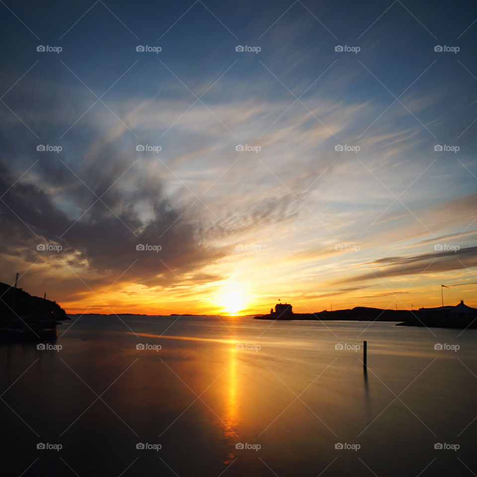 Sunset at Marstrand, Sweden. Beautiful scenery just outside Nautic Hotel, where we stayed for a night. I used long shutter to get silky look on sea
