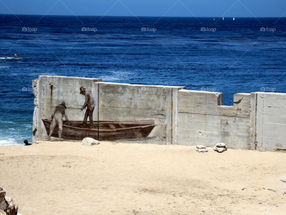 Fishermen's mural. fishermen's mural painted on sea wall in Monterey, California. 