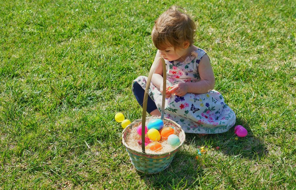 Young Girl On Grass With Easter Basket