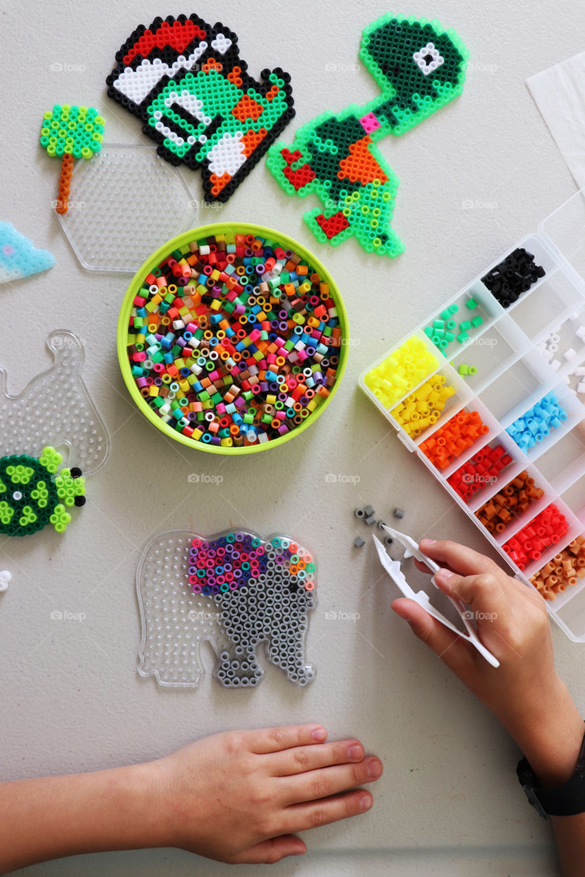 Child creating Fuse Bead picture