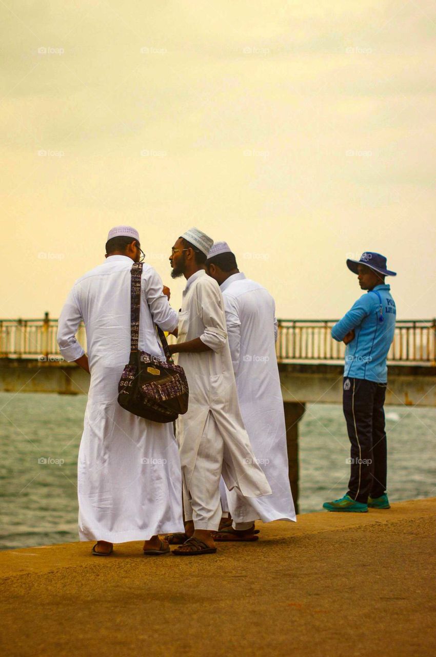 Muslim men and an outsider