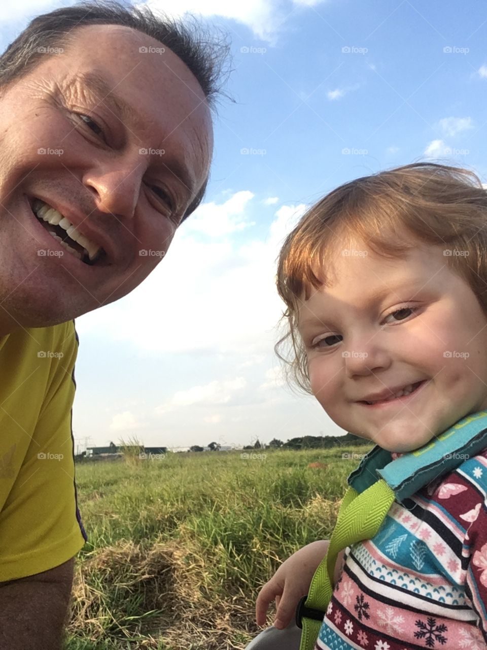 Our smiles full of joy after riding the bike.  Long live the family! / Nossos sorrisos cheios de alegria depois de pedalar na bicicleta. Viva a família!