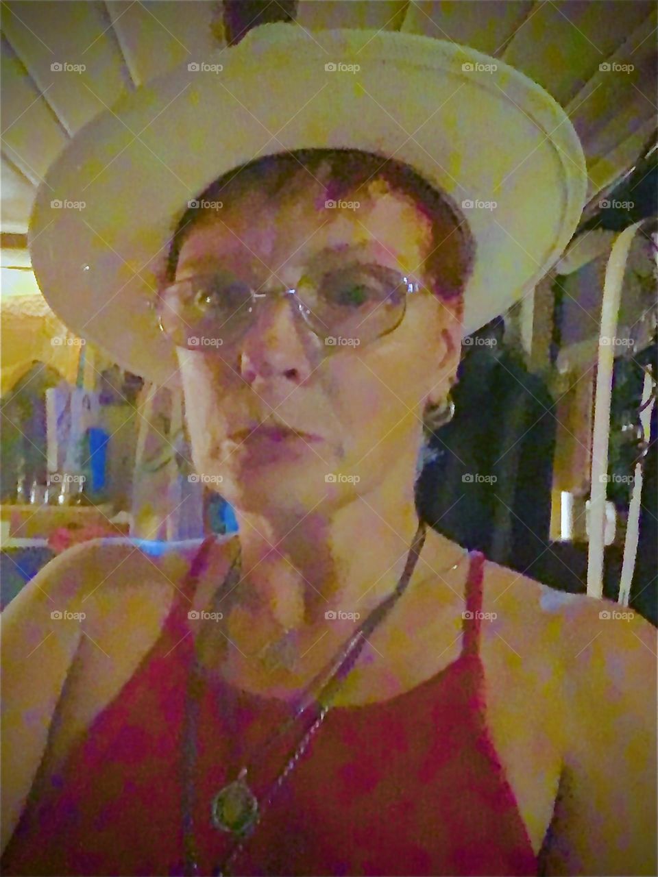 In the dim illumination of a nightlight and a candle I snapped this selfie wearing my new straw Panama hat that I intended to wear out in the summertime. 2021. Hypnotic Productions