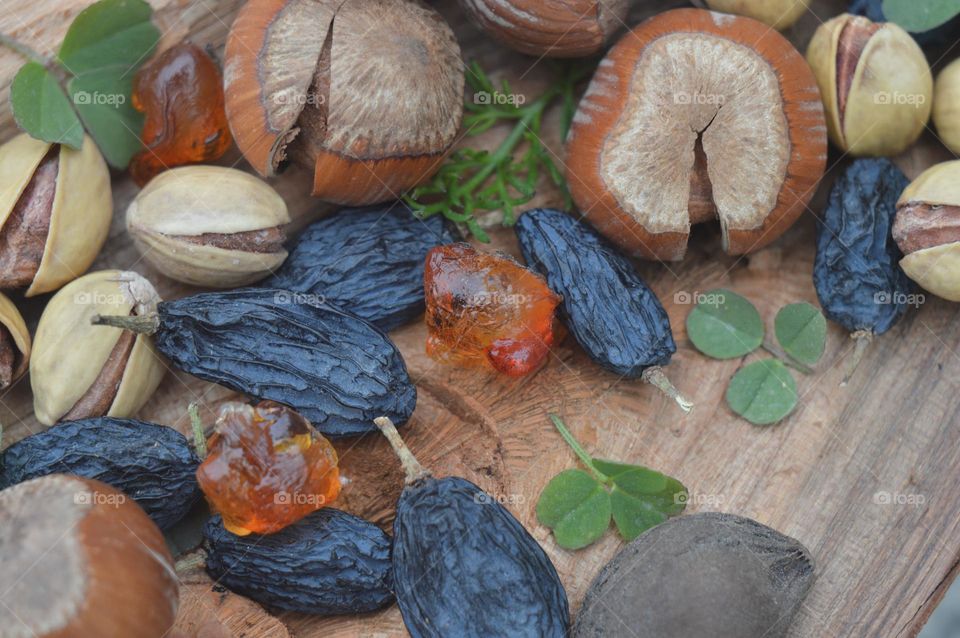 dried fruits, raisin hazelnuts, pistachios, on the board