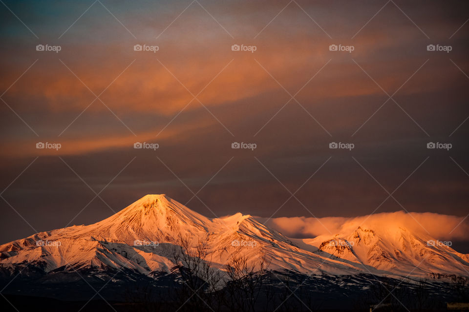 Evening in Kamchatka.  snowy Avachinsky volcano in sunset light.