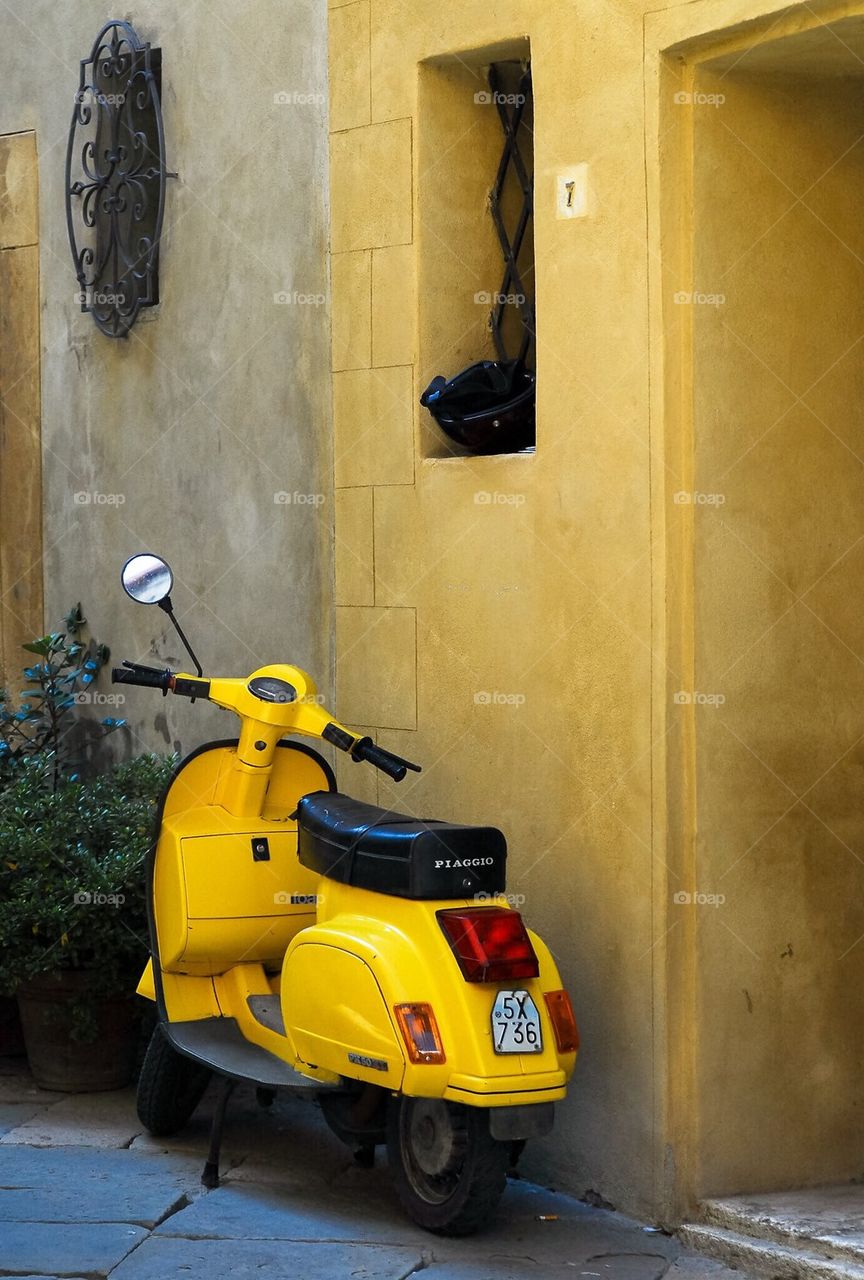 Yellow scooter and yellow house