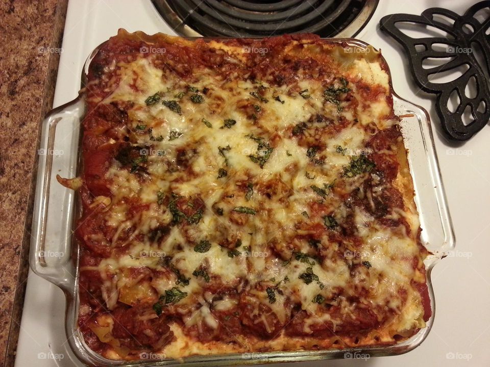 homemade lasagna!! delicious layers of cheese and meat sauce with a dash of allspice to make it nice