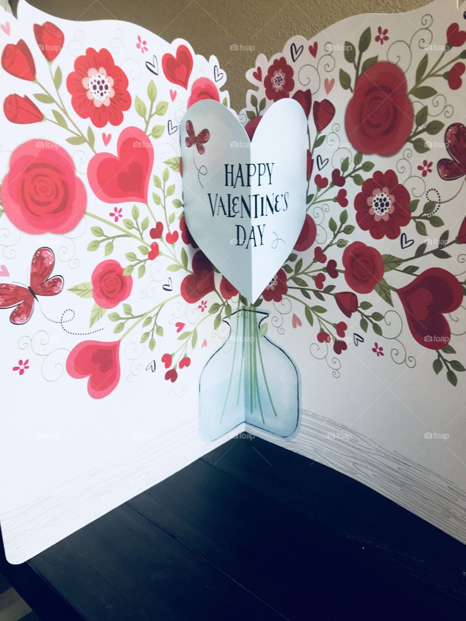 A happy Valentine’s Day card with hearts, flowers and roses  celebrating Valentine’s Day for your sweetheart. USA, America 