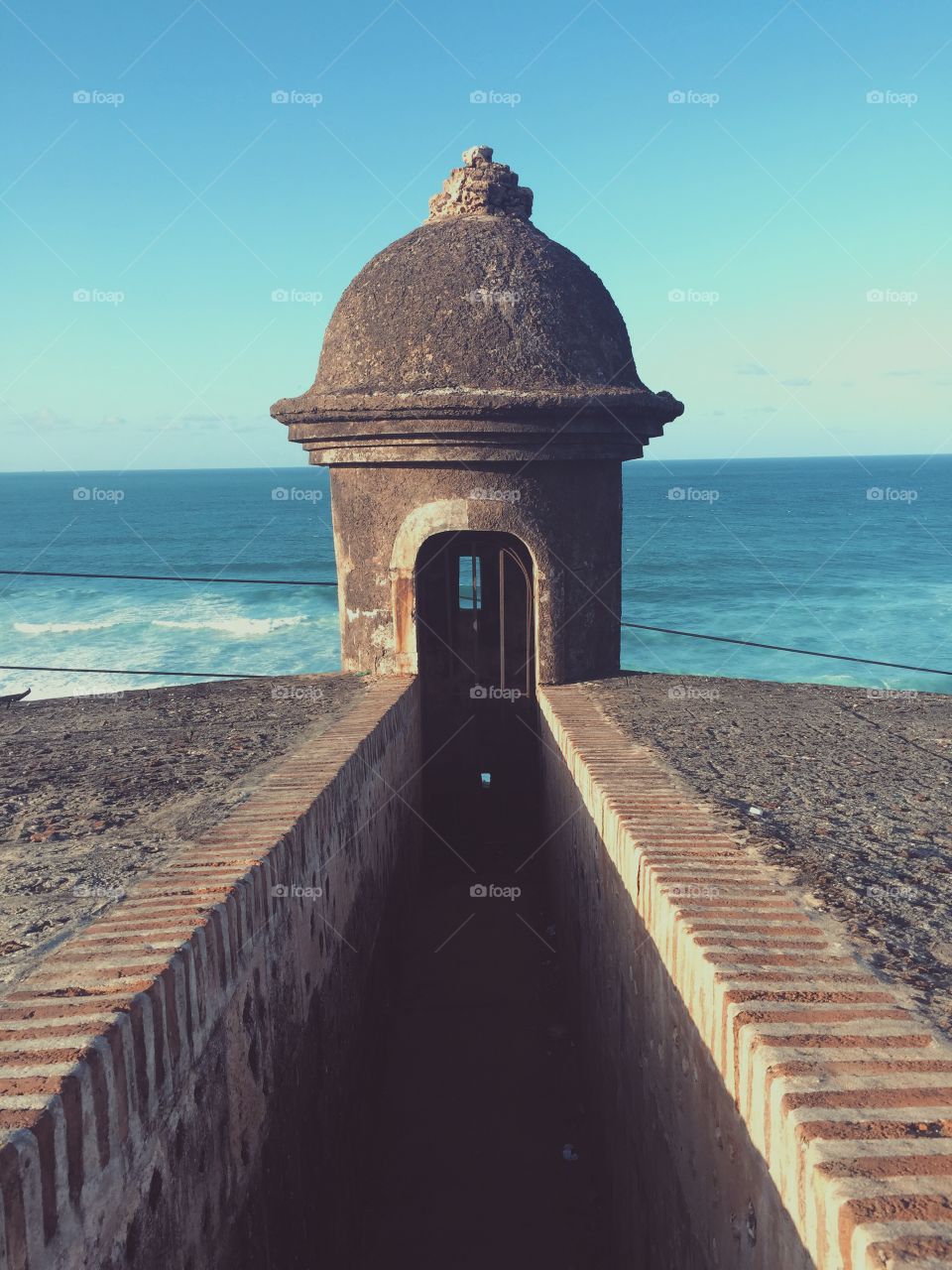 Close-up of fort against sea