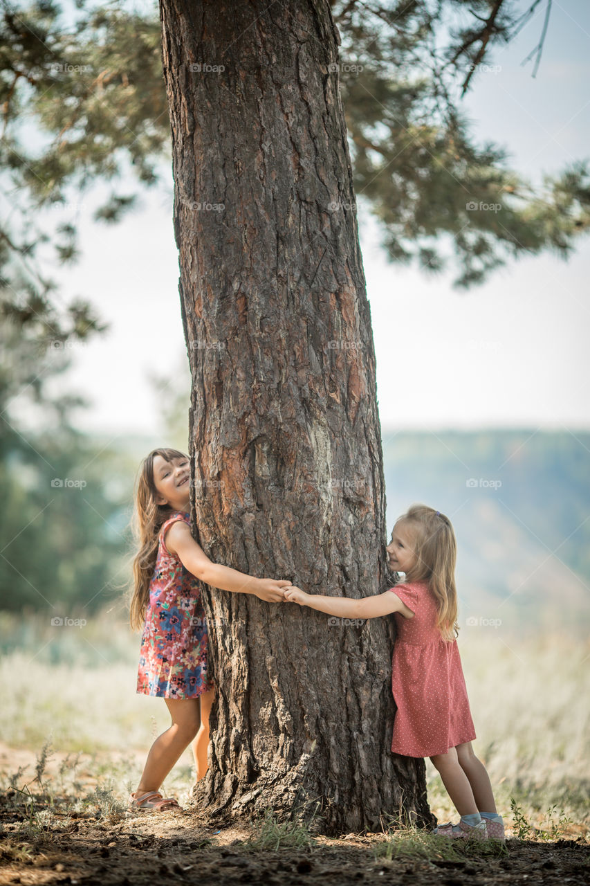 Little sisters playing outdoor